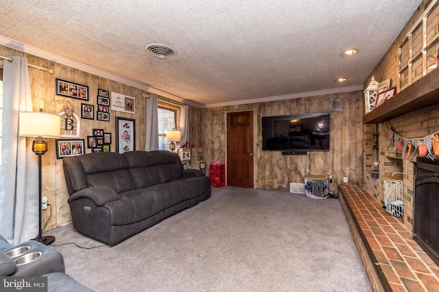 living room featuring a textured ceiling, carpet floors, a fireplace, and wooden walls