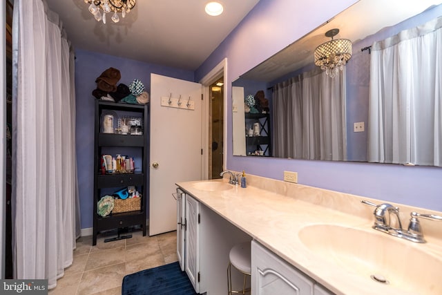 bathroom with vanity and an inviting chandelier