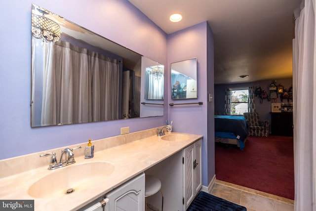 bathroom featuring tile patterned flooring and vanity