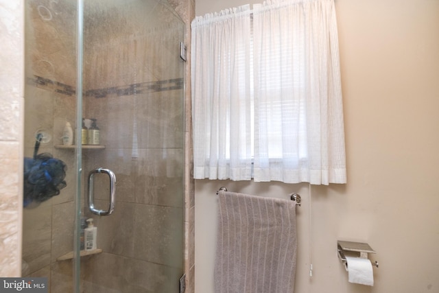 bathroom featuring an enclosed shower