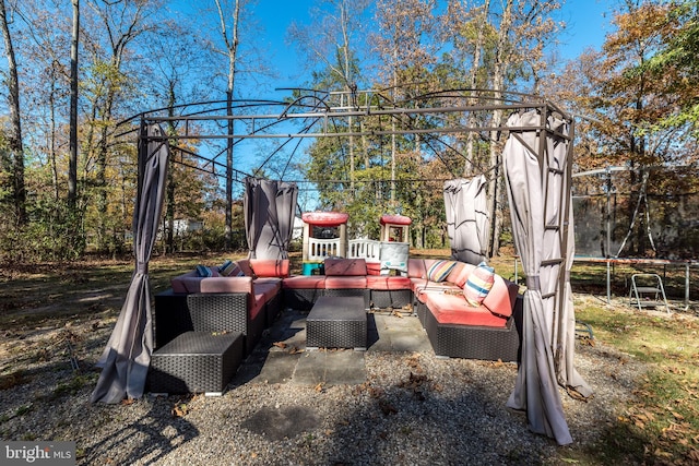 view of patio with outdoor lounge area and a trampoline