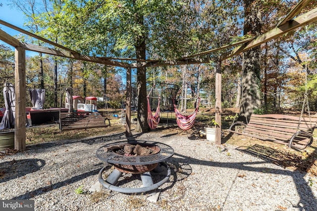 view of yard featuring an outdoor fire pit