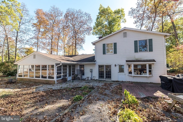 back of house with a sunroom