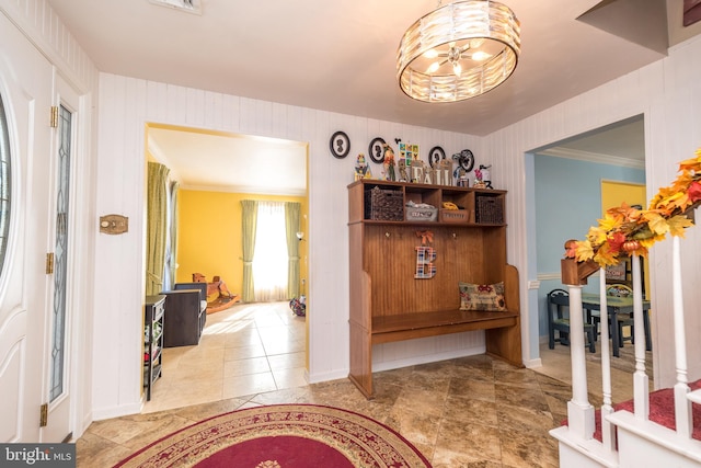 interior space with a notable chandelier and ornamental molding