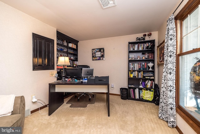 home office with light colored carpet