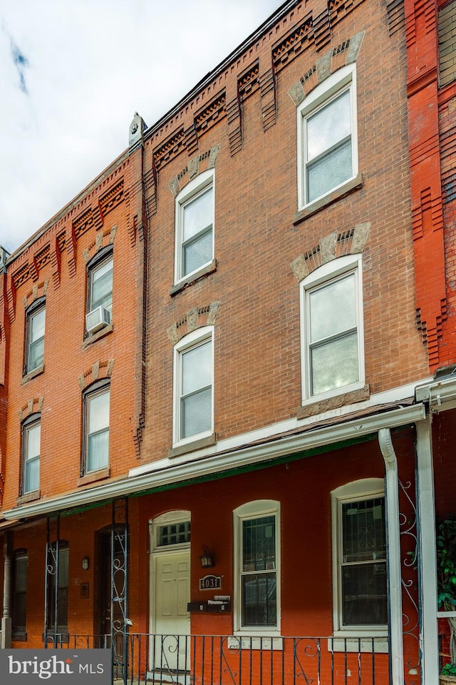 view of building exterior with cooling unit