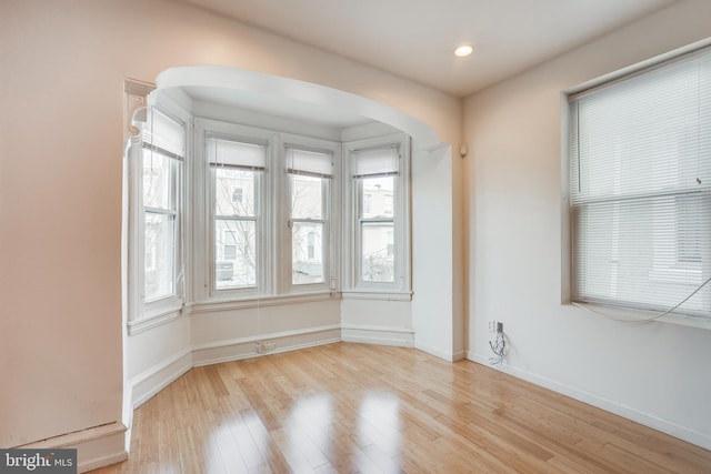 unfurnished room with light hardwood / wood-style flooring