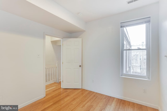 unfurnished room featuring light wood-type flooring