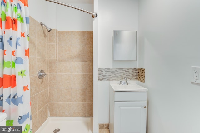 bathroom with vanity and curtained shower