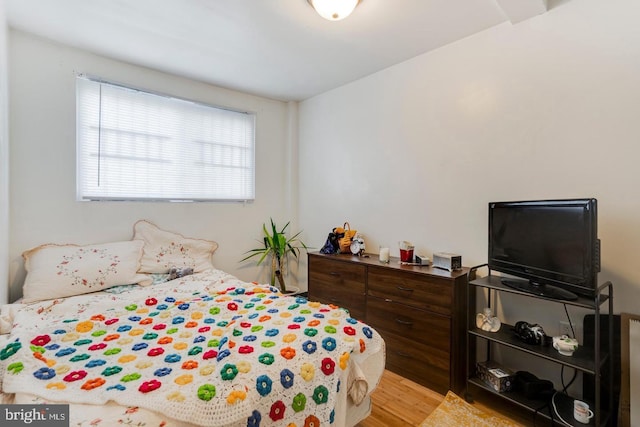 bedroom with light wood-type flooring