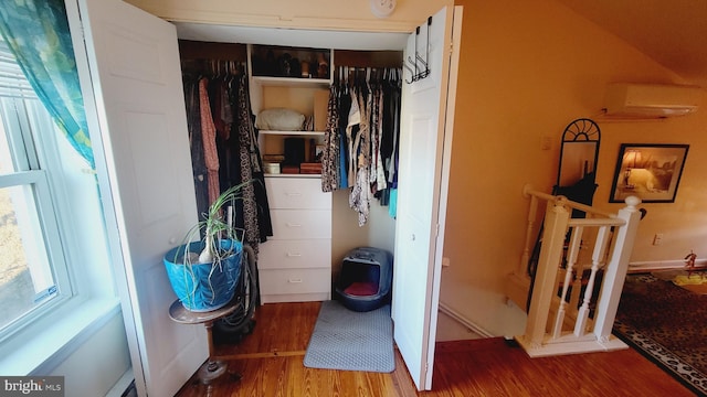 closet featuring a wall mounted air conditioner