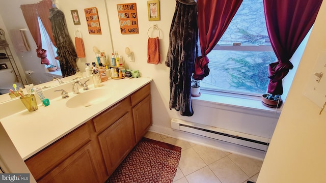 bathroom featuring a baseboard heating unit, vanity, and tile patterned floors