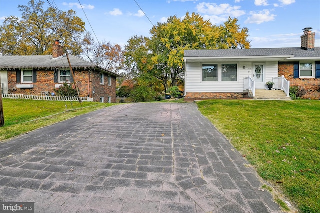 ranch-style home with a front lawn