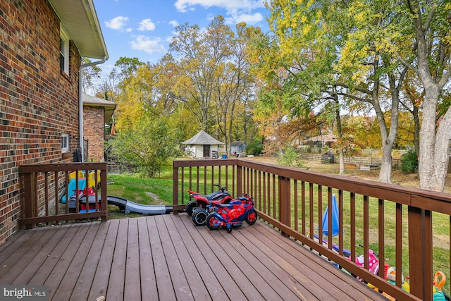 wooden deck with a yard