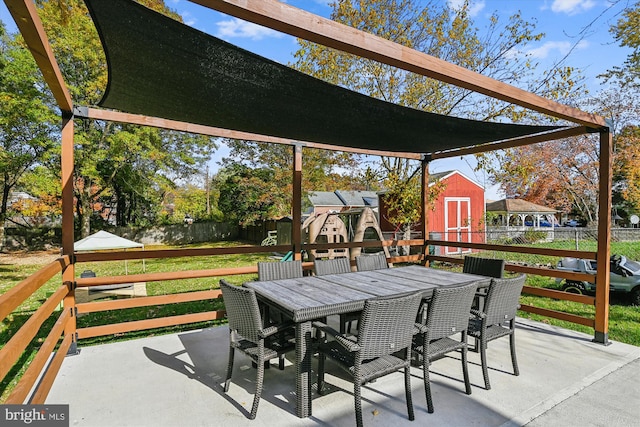 view of patio / terrace featuring a storage unit