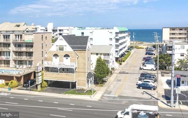 birds eye view of property featuring a water view