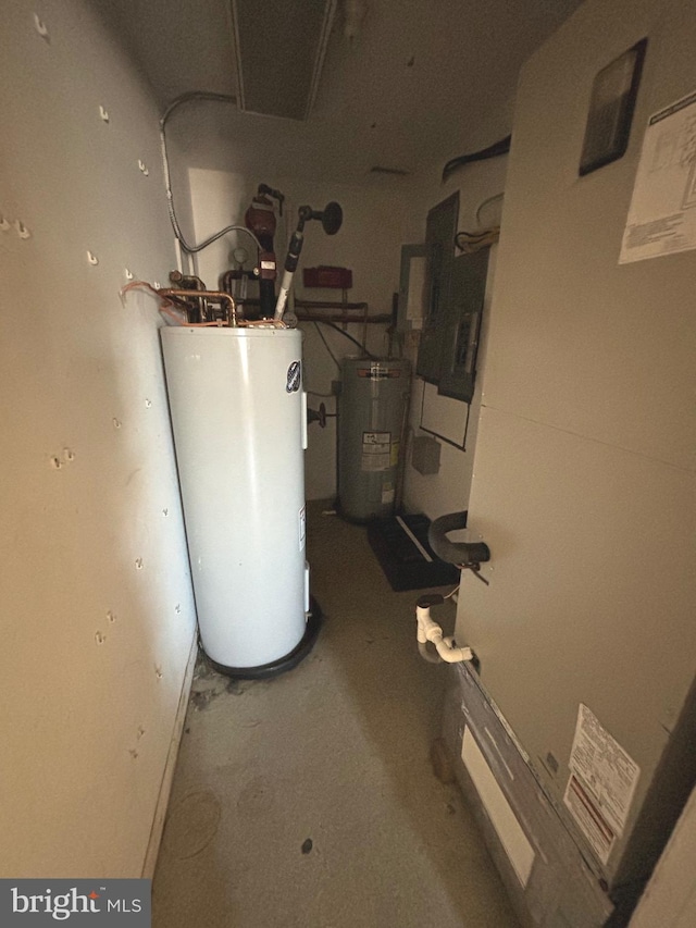 utility room featuring water heater, electric panel, and heating unit