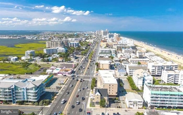 bird's eye view featuring a water view and a view of the beach