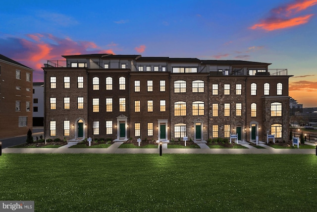 view of outdoor building at dusk