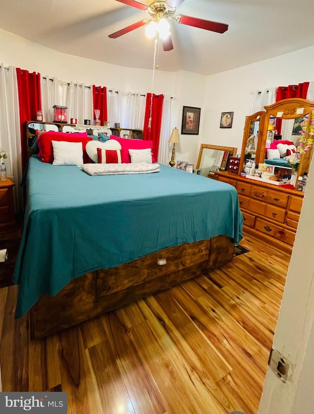 bedroom featuring ceiling fan and hardwood / wood-style flooring