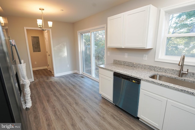 kitchen with decorative light fixtures, stainless steel appliances, sink, and a wealth of natural light