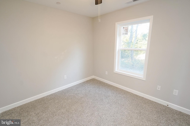 spare room with ceiling fan and carpet floors