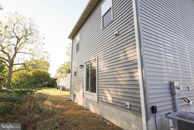 view of property exterior featuring central air condition unit