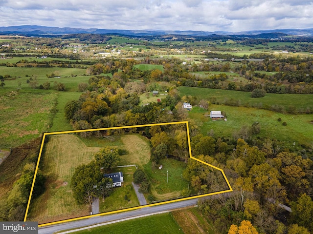 birds eye view of property featuring a mountain view