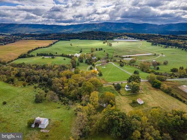 drone / aerial view featuring a mountain view and a rural view