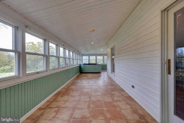 unfurnished sunroom with lofted ceiling and wood ceiling