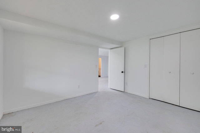 unfurnished bedroom with a closet