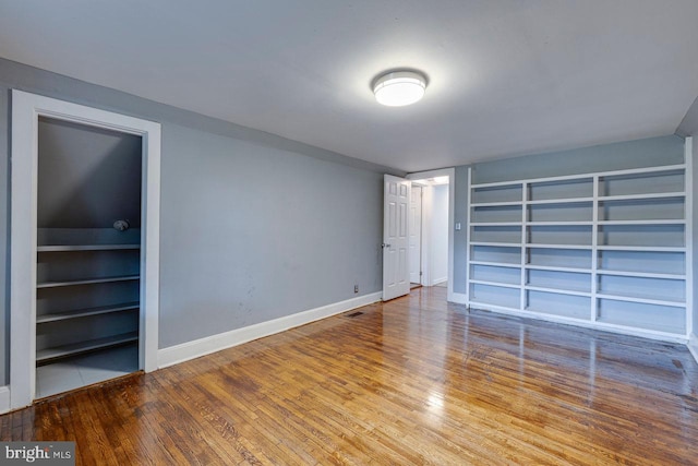 unfurnished bedroom featuring hardwood / wood-style floors