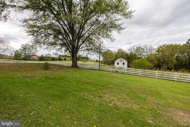 view of yard with a rural view