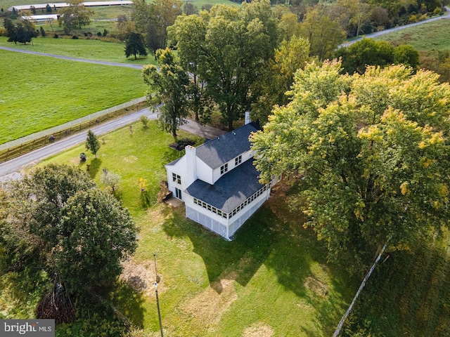 birds eye view of property with a rural view