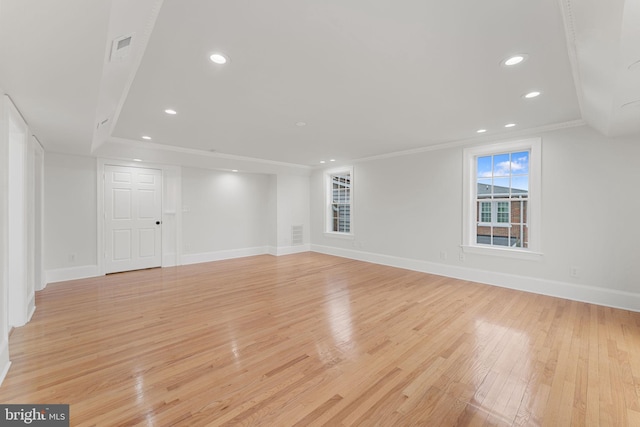 interior space with crown molding and light hardwood / wood-style floors