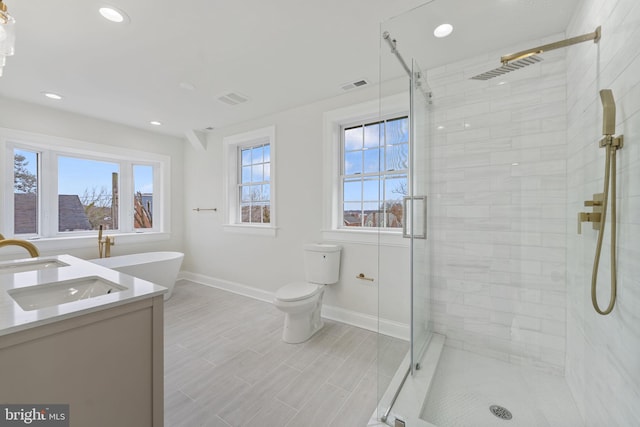 full bathroom with toilet, vanity, and shower with separate bathtub