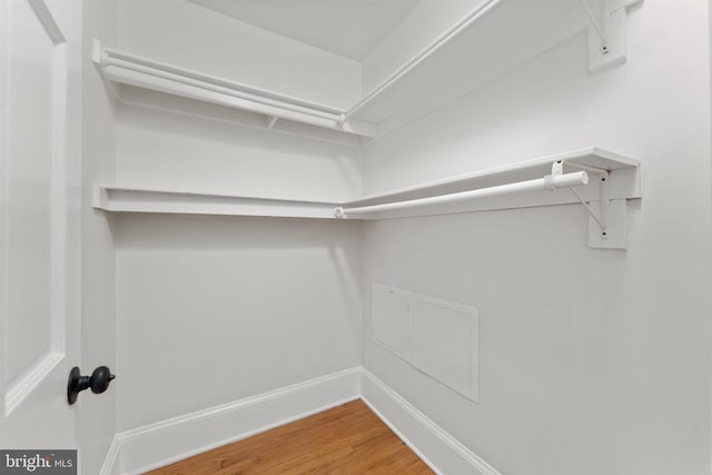 walk in closet featuring hardwood / wood-style floors