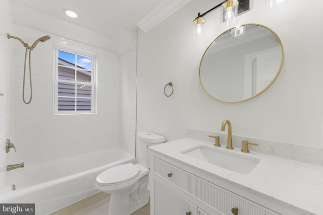 full bathroom featuring tiled shower / bath, ornamental molding, toilet, and vanity