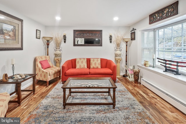 living room with hardwood / wood-style flooring and baseboard heating