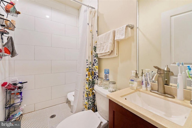 bathroom with toilet, a shower with curtain, vanity, and tile patterned flooring