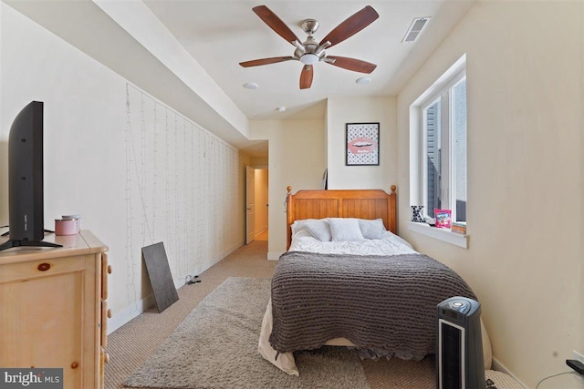 bedroom with light colored carpet and ceiling fan