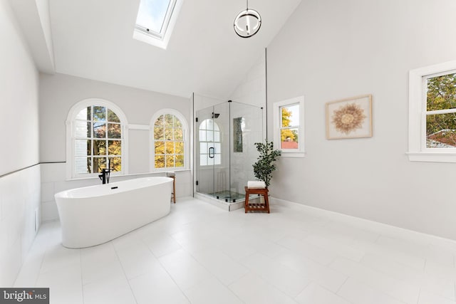 bathroom with a healthy amount of sunlight, plus walk in shower, high vaulted ceiling, and tile patterned flooring