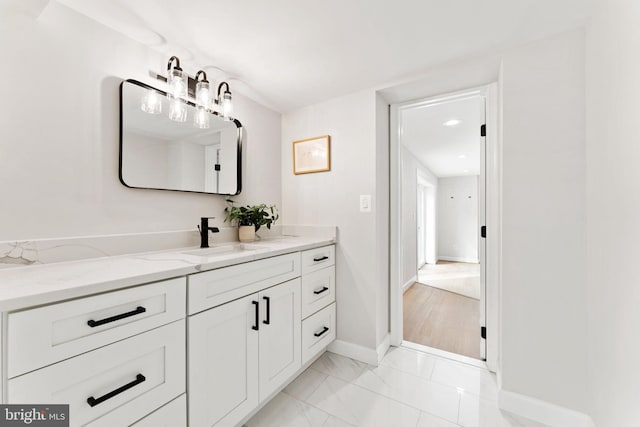 bathroom featuring vanity and wood-type flooring