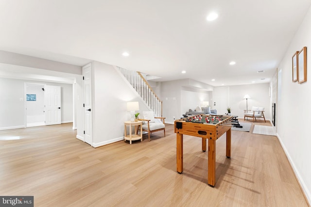 recreation room featuring light hardwood / wood-style floors