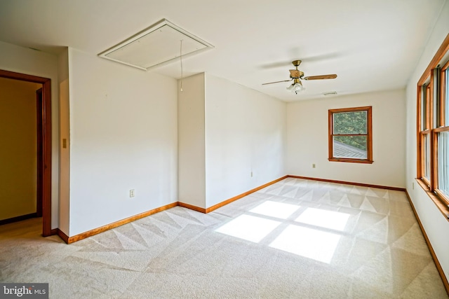 carpeted empty room with ceiling fan