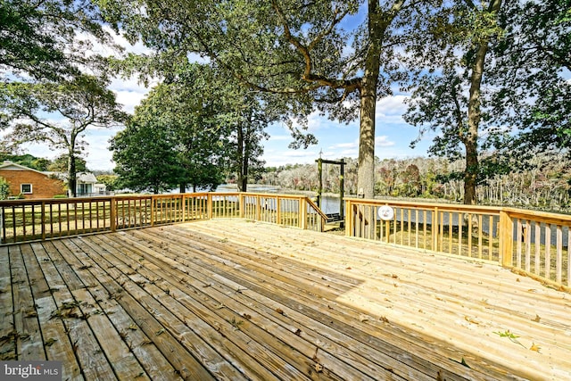 wooden deck with a water view