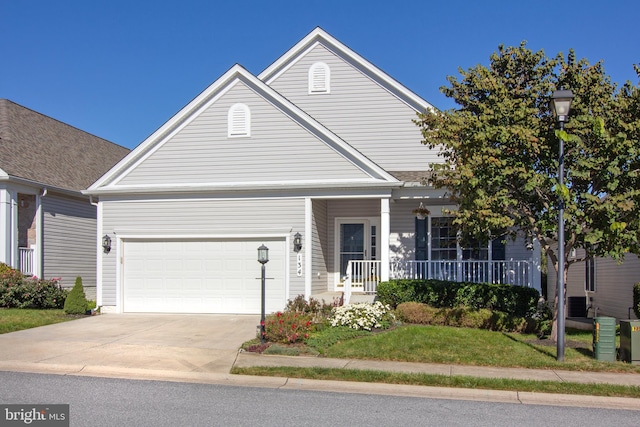 view of front of house with a porch and a garage