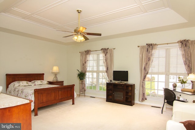 bedroom with ceiling fan, multiple windows, and light colored carpet