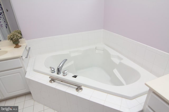 bathroom featuring vanity, tiled bath, and tile patterned floors