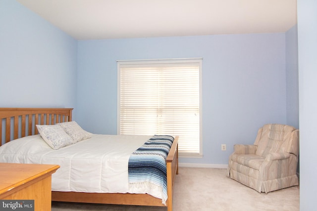 bedroom featuring light carpet